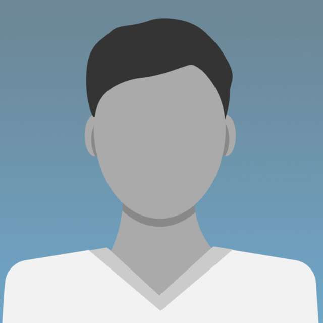 Dr. Rodney D. Wiersma posing outside, wearing a white coat and smiling.