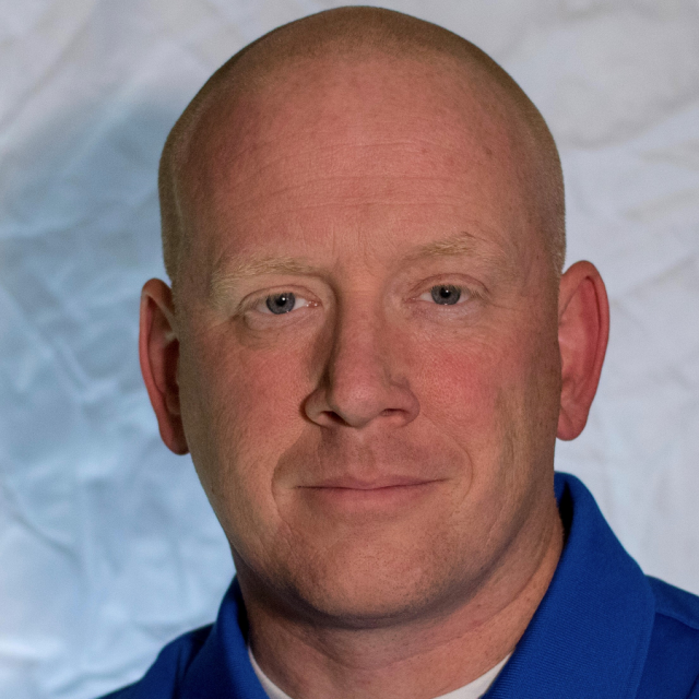 David Long, smiling man in blue blazer and checked shirt, featured in a professional headshot for UCLA Health’s Operation Mend.
