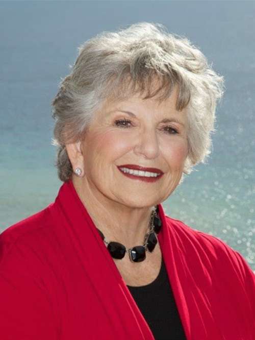 Headshot of Barbara Patman smiling in an outdoor setting