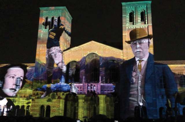 Campus building with light show projected onto it