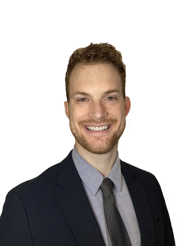 Dr. Atwood headshot. He's wearing a gray button up shirt, a black tie and a black suit.
