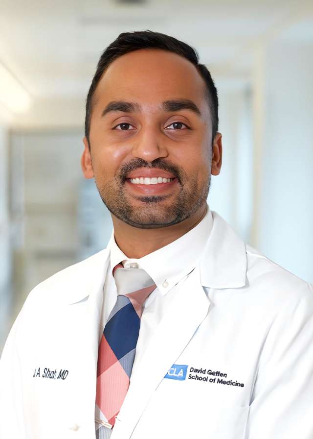 Headshot of Jay Shah, MD in a white Lab Coat
