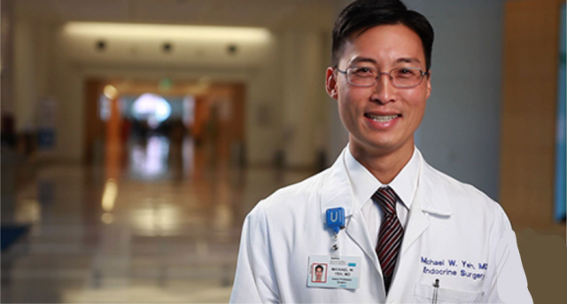 Dr. Michael Yeh wearing his lab coat and glasses at UCLA Health.