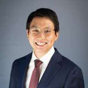 headshot of Po Wei Kang in black suit