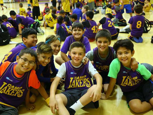 Camp Lakers kids smiling at camera.