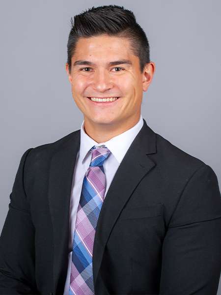 Dr. Dylan Tookey in a black suit