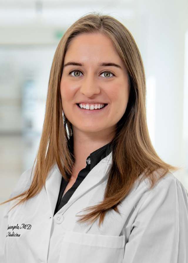 Headshot of Laura Santangelo, MD in a white Lab Coat
