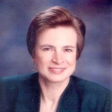 headshot of Bevra Hahn in green coat