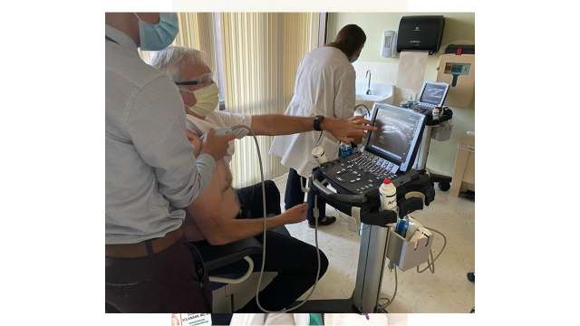 Fellow performing ultrasound