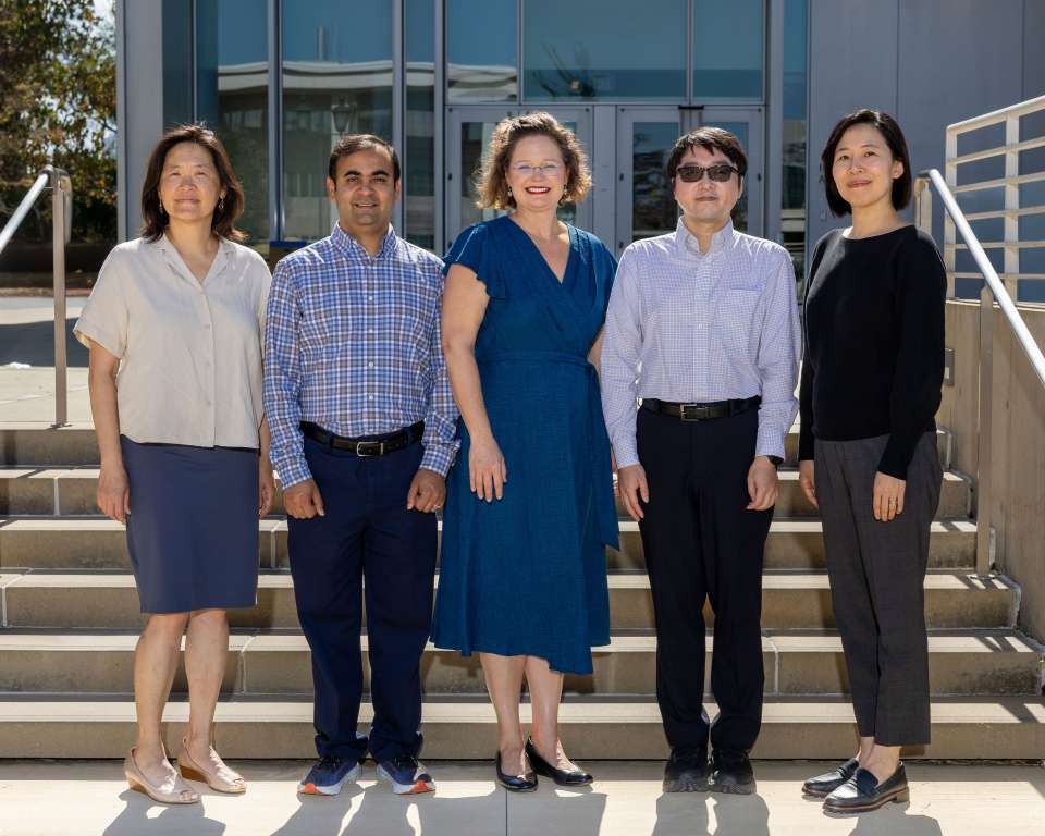 Pathology Quality Improvement Program Leaders standing on the Geffen Hall exterior stairs