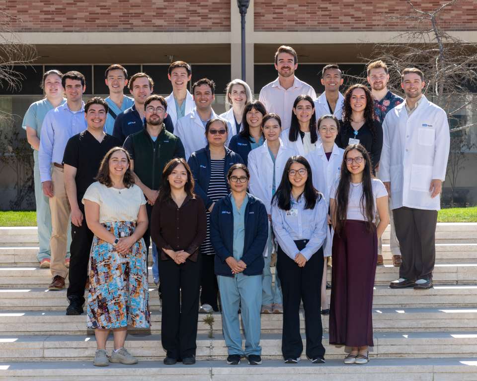 Pathology Residents and Directors on exterior stairs