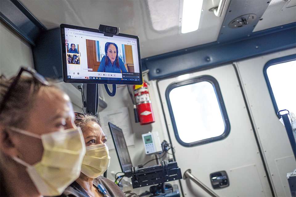 Dr. May Nour, director of the Arline & Henry Gluck Mobile Stroke Rescue Program, remotely reviews the patient’s results.
