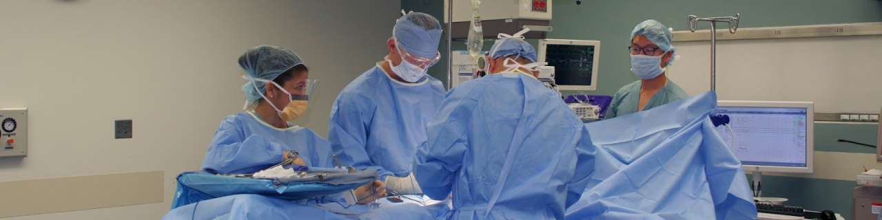Doctors in an operating rooms doing surgery.