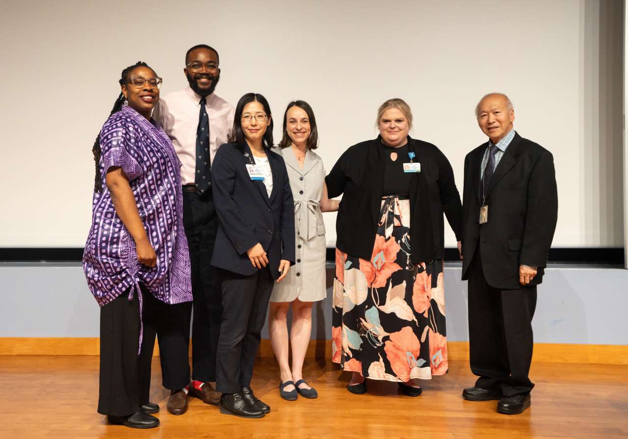 The Six physicians who presented at Tamkin Hall pose in business attire.