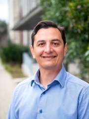 Chris Moriates Headshot in blue shirt