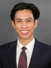 headshot of Dr. Michael Le in a dark suit