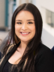 Stephanie Lira in a black business dress