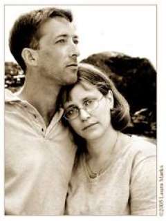 Robert standing outside with his wife leaning on his shoulder