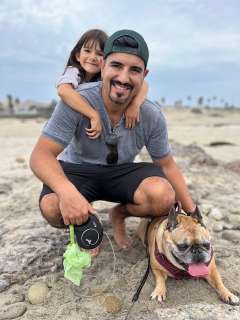 Alan Zamora with his daughter and dog