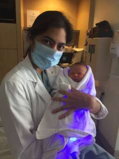 Dr. Rashmi Rao holds baby Cléo