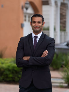 Dr. Amar U. Kishan standing outside