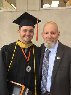 Jim with son at graduation
