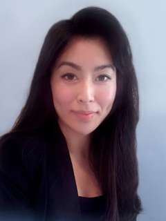 Professional headshot of Jena Lee with long, dark hair and a blazer.