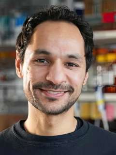 Mohamad Abedi smiling portrait in a laboratory