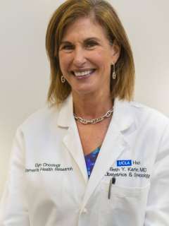 Dr. Beth Karlan wearing a lab coat