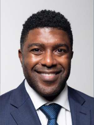 headshot of Michael Davis in blue suit