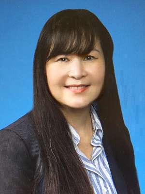 headshot of Germaine Le in black blazer