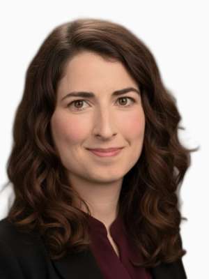 Anna Sciali headshot, slight smile, dark blazer