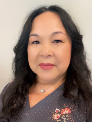headshot of Yanina Venegas in floral blouse