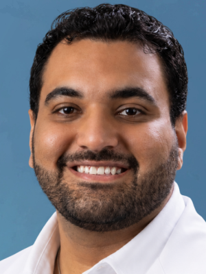 Man smiling in white coat