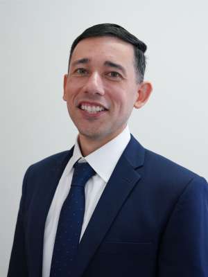 Headshot of Albert Haro in Blue Suit