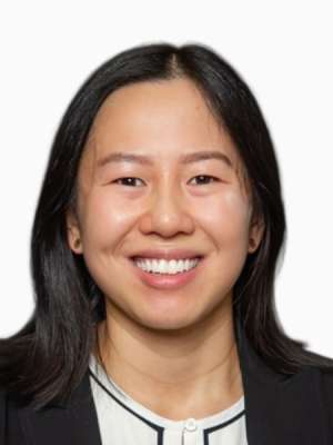 Margaret McGurn, smiling professional headshot in blazer