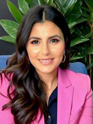 headshot of Katrina Barron in a pink blazer