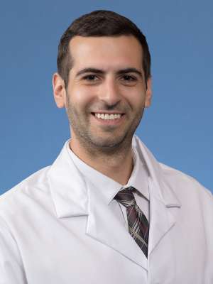 A headshot of Theo Sher, MD