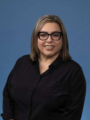 headshot of Judy Cervantes in black button down shirt