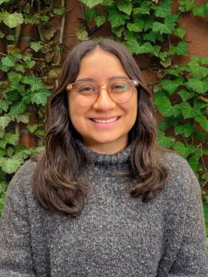 Headshot of Kimberly Ramirez wearing a grey sweater