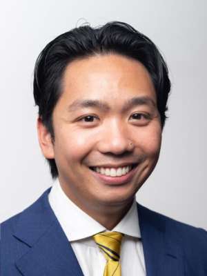 Headshot of Anton Pham in blue suit
