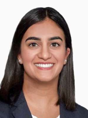 Smiling professional headshot of a woman in a blazer