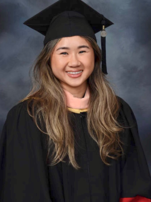 Sandy Phan wearing a graduation cap and gown