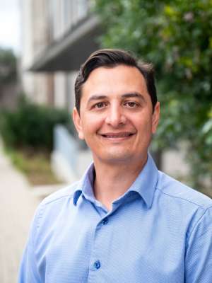 Chris Moriates Headshot in blue shirt