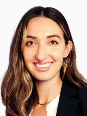 Patricia Stan smiling headshot wearing blazer