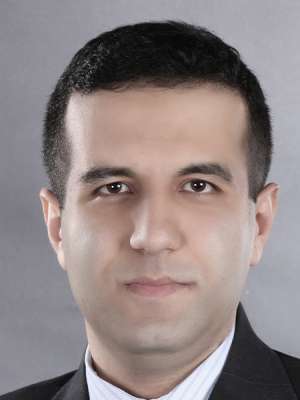 headshot of Dr. Reza Mohebi in black suit