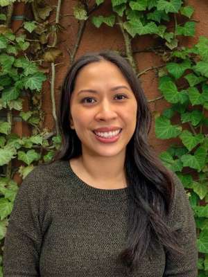 Headshot of Monica Arana wearing a grey shirt