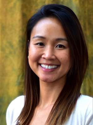 headshot of Dr. Kim Vu in front of brown backdrop