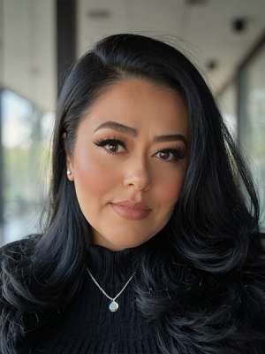 headshot of Slyvia Alamillo wearing a black turtleneck