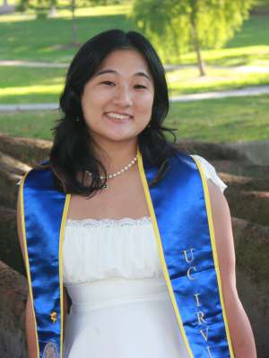 Tricia, who is wearing a graduation stole